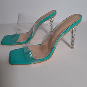 Women's square toe teal heels with clear strap and heel. Size 9.